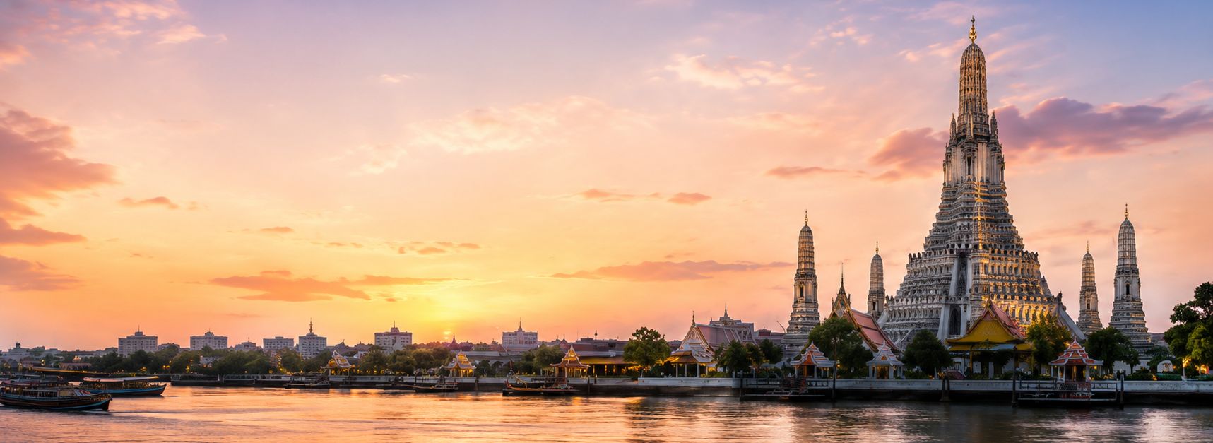 Wat Arun temple at sunset on the Chao Phraya River, Bangkok